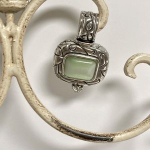 Beautifully designed silver pendant with green stone and fashion diamond.